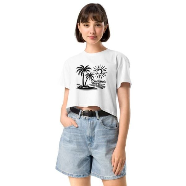 Woman wearing Island Summer Vibes white crop top with palm trees, sun, and island illustration