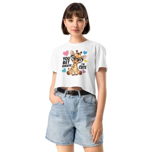 Woman wearing Cute Giraffe crop top with a cartoon giraffe and “You Bet Giraffe I’m Cute” quote