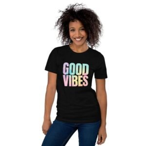 Woman wearing Good Vibes t-shirt with palm trees and colorful “Good Vibes” text